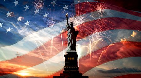 Independence day. Liberty enlightening the world Statue of Liberty on the background of flag usa, sunrise and fireworks